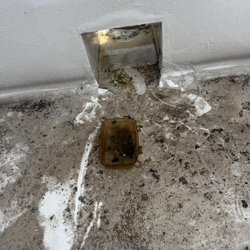 Roof scupper drain cleared on commercial TPO roof