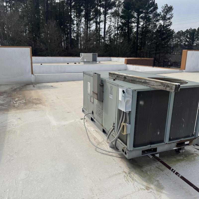 Commercial rooftop HVAC unit on flat TPO roof