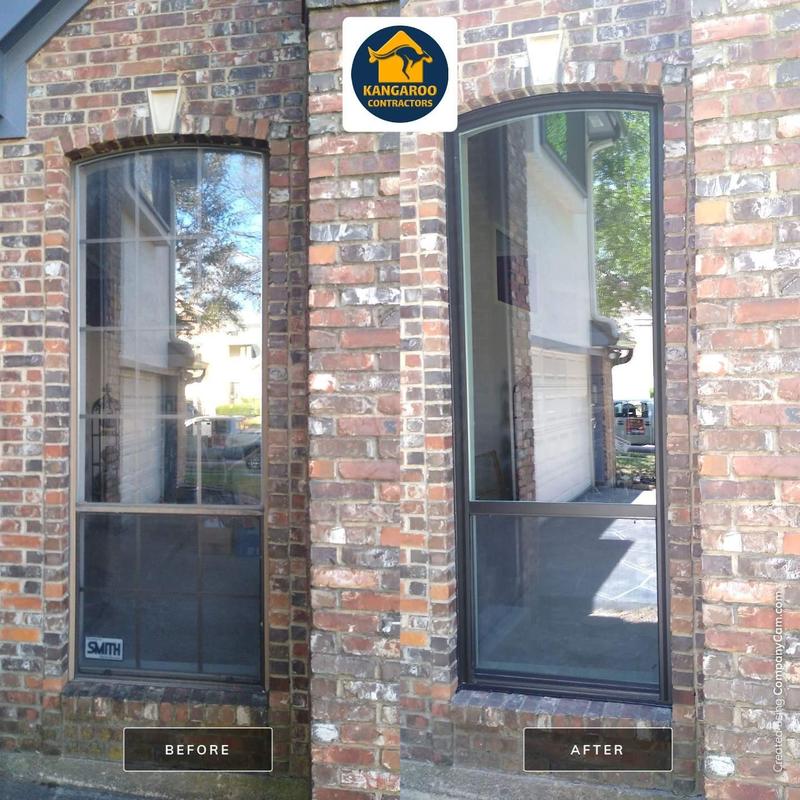Vinyl window replacement with bronze exterior frames