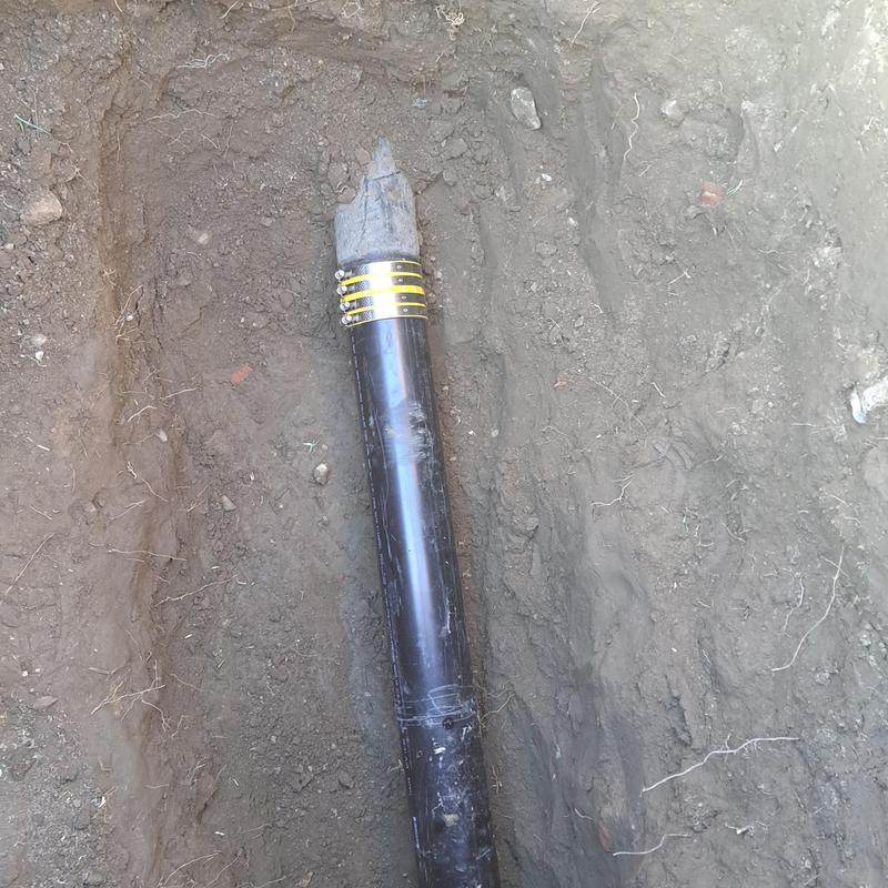 Sewer line with new cleanout installation in trench