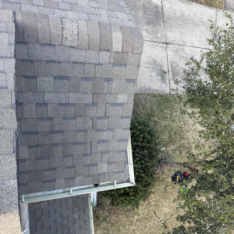 Architectural asphalt shingle roof with gutter in Houston home