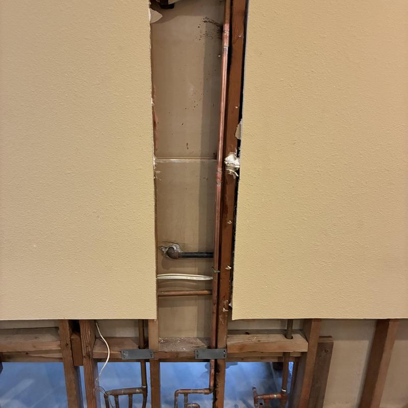 Three-quarter inch hot water line behind wall panels