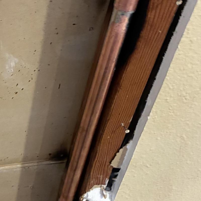 Three-quarter inch copper hot water line behind drywall