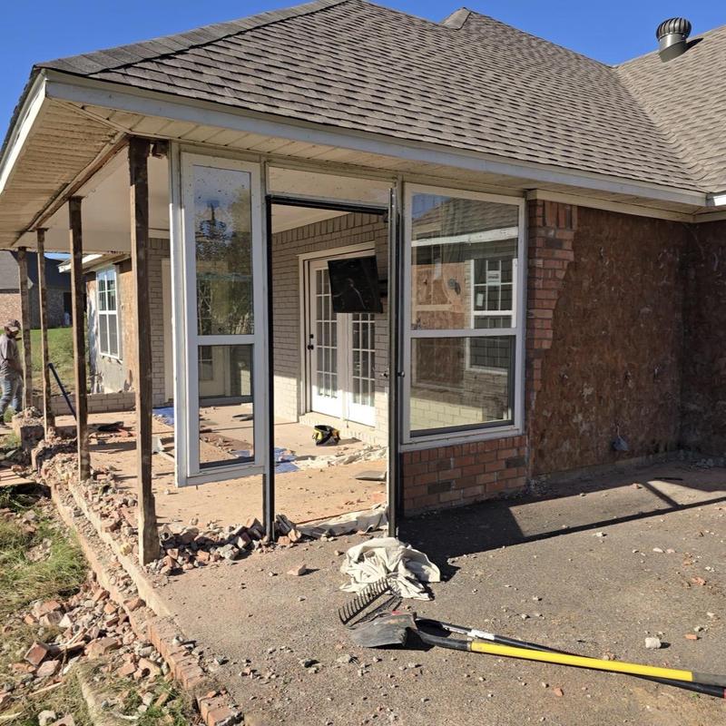 Patio addition brick and window installation in progress