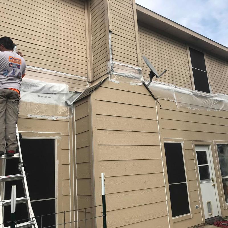 LP SmartSide siding installation on house exterior LP SmartSide siding installation on house exterior