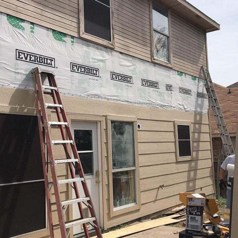 LP SmartSide siding installation on two-story house exterior LP SmartSide siding installation on two-story house exterior