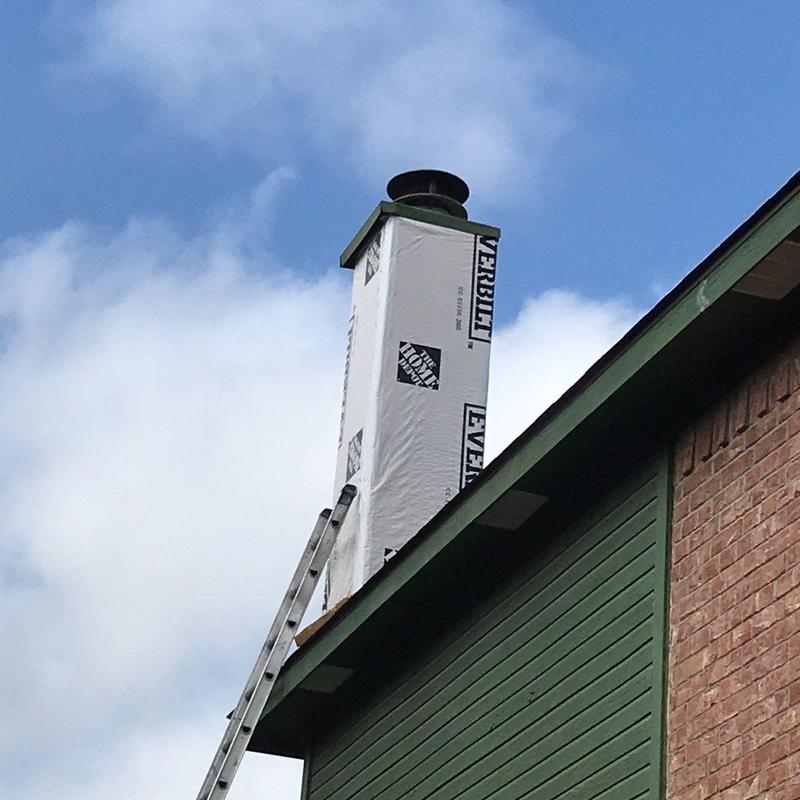 Chimney wrapped with protective vapor barrier in McKinney Chimney wrapped with protective vapor barrier in McKinney