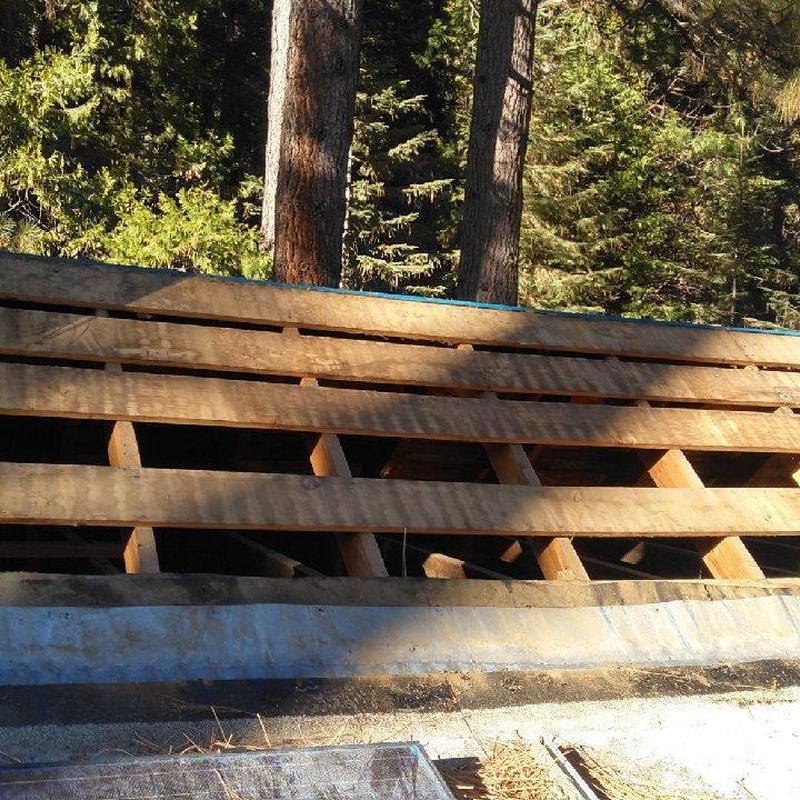 Roof decking with exposed wooden beams on old cabin
