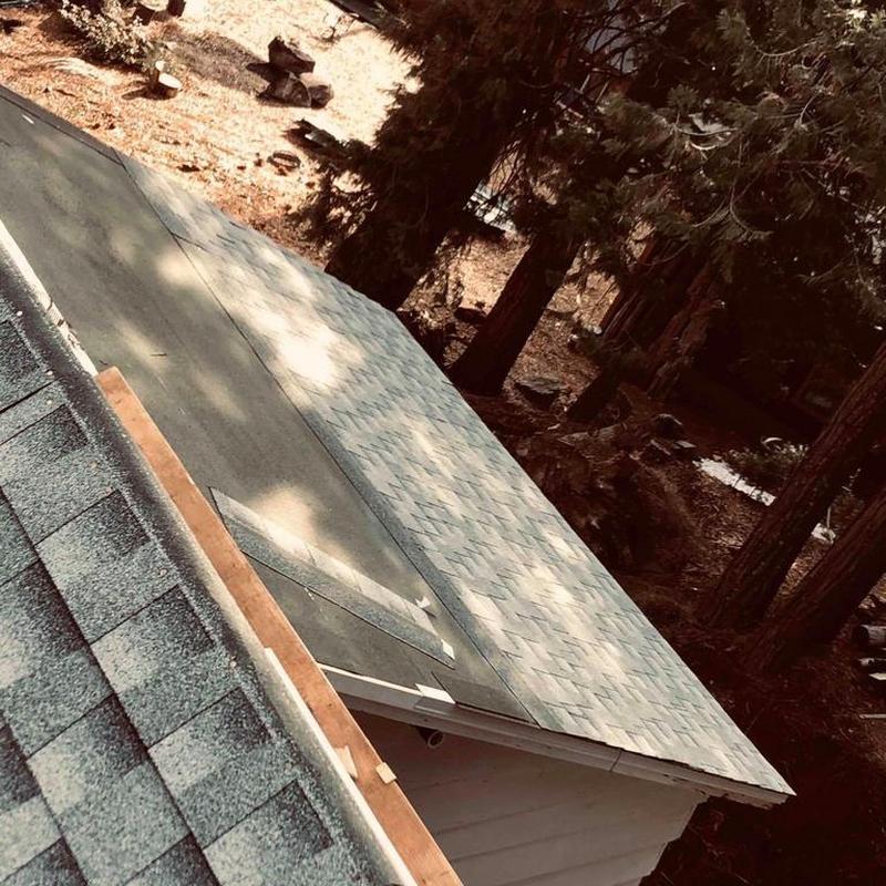 Asphalt shingle roof installation on cabin roof
