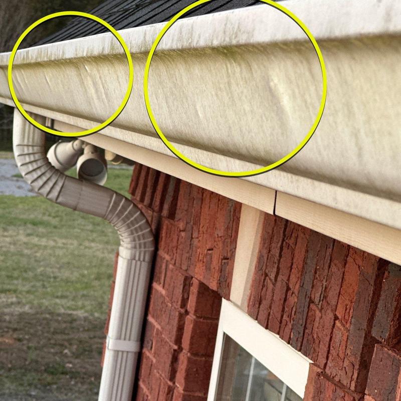 Vinyl gutter with visible dirt and discoloration