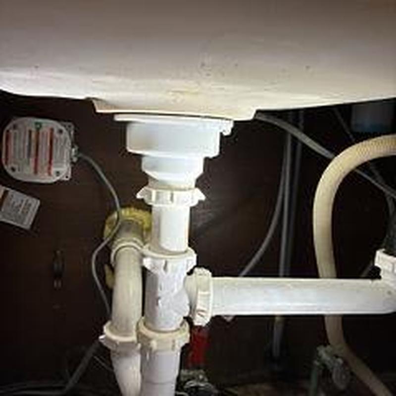 Kitchen sink drain and sink strainer installation under cabinet