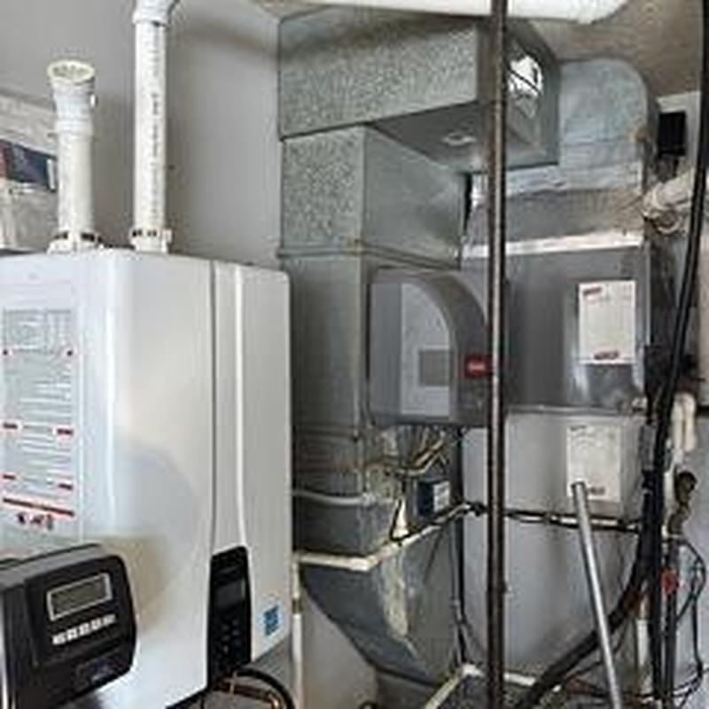 Navien tankless water heater with exhaust pipes