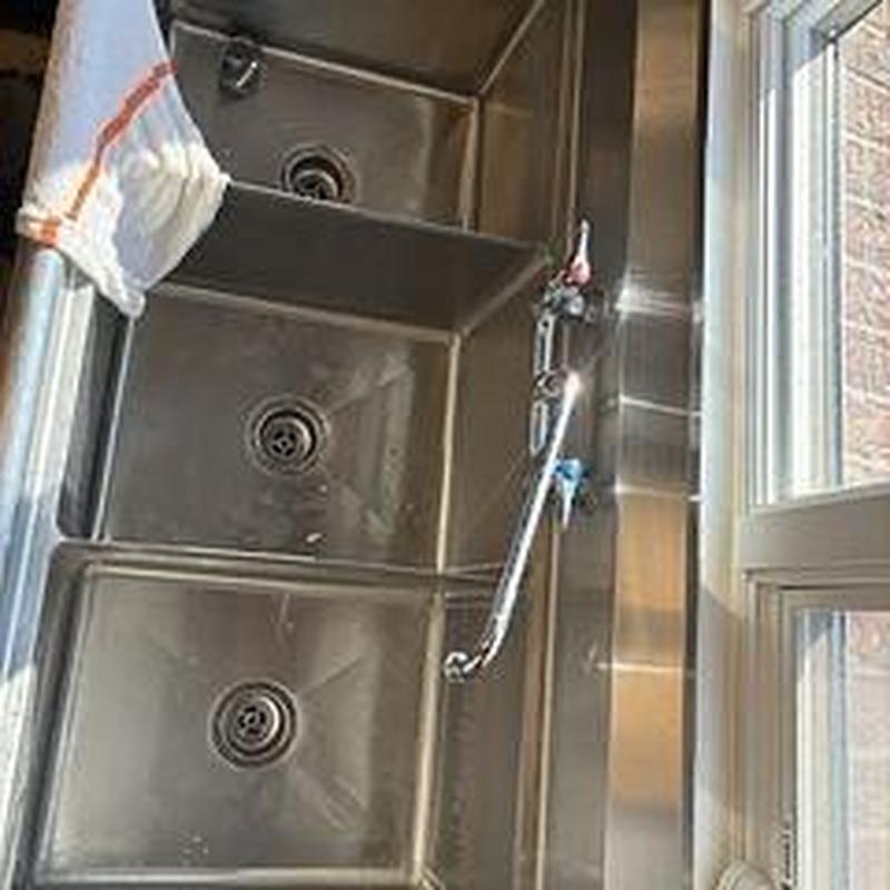 Three bay kitchen sink basket strainers and drain piping
