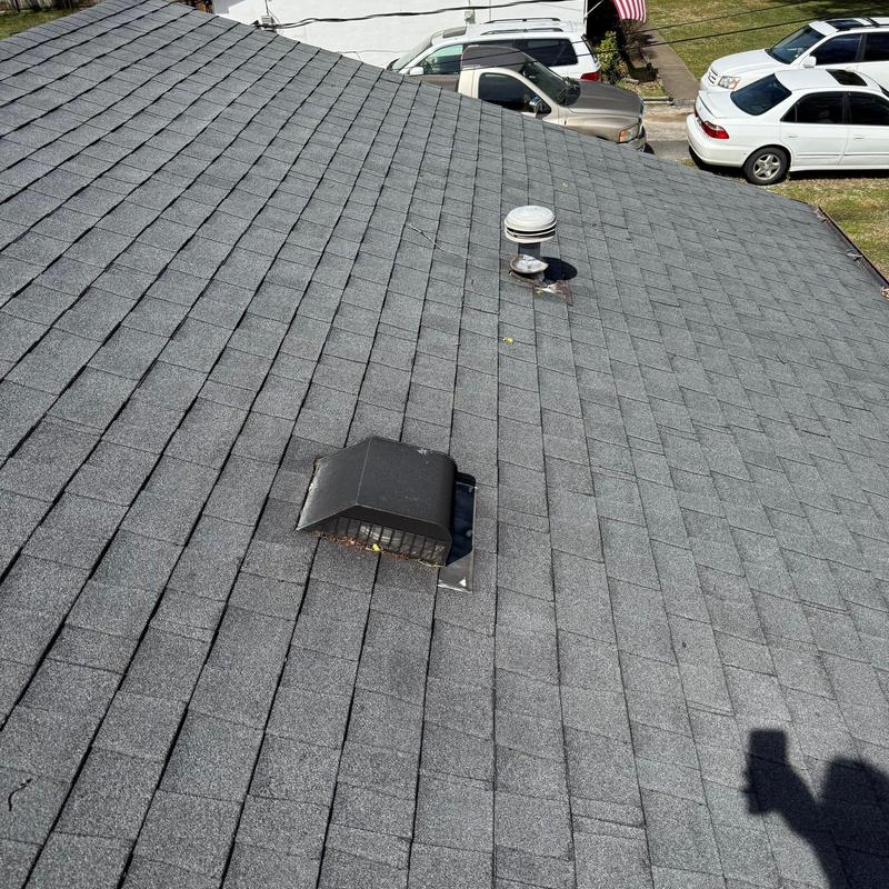 Asphalt shingle roof with vent pipe and exhaust vent