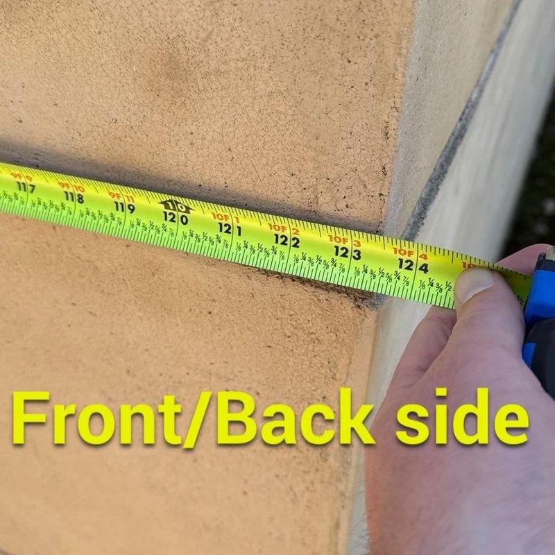 Stucco wall crack measurement with tape measure