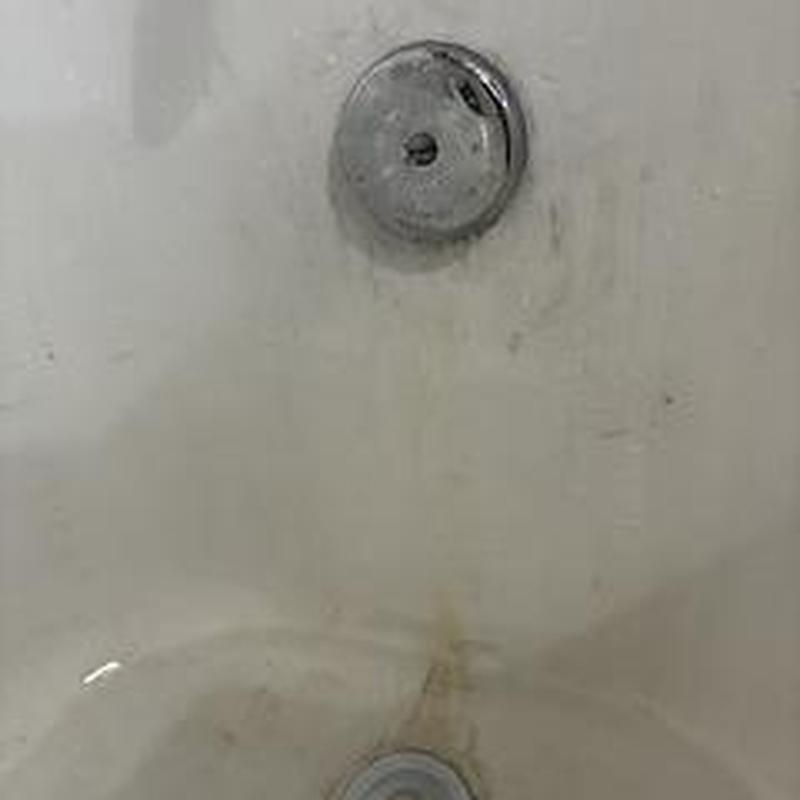 Lift and turn bathtub drain stopper installed in tub