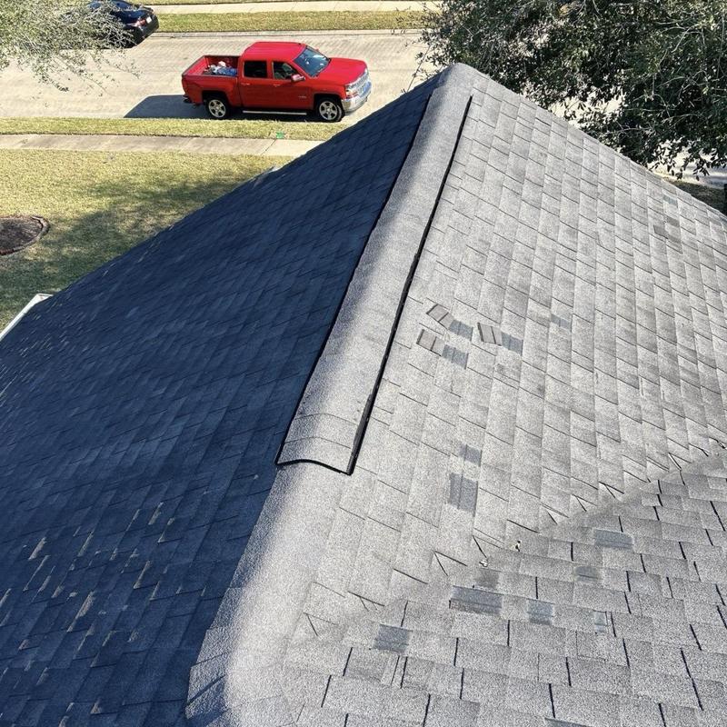 Asphalt shingle roof with storm damage and granule loss