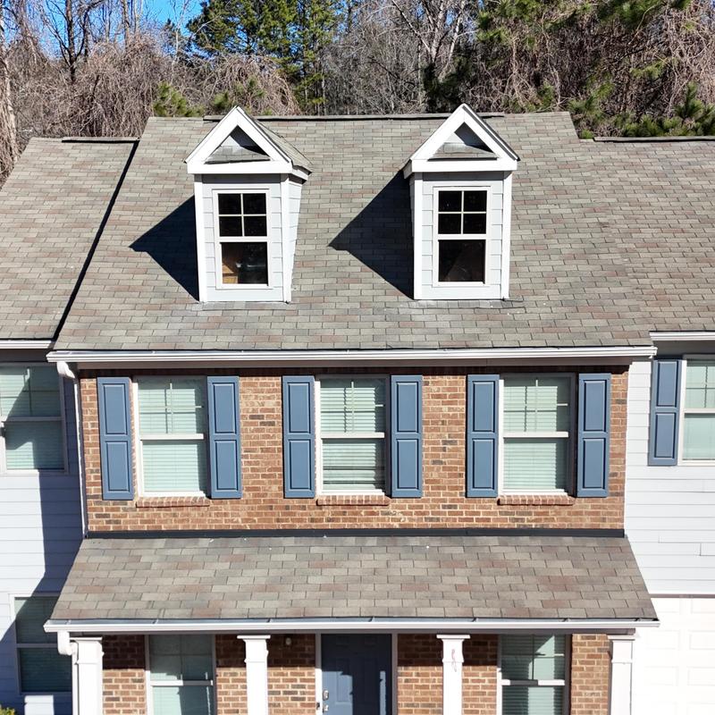 3-tab shingle roof with window shingle damage areas