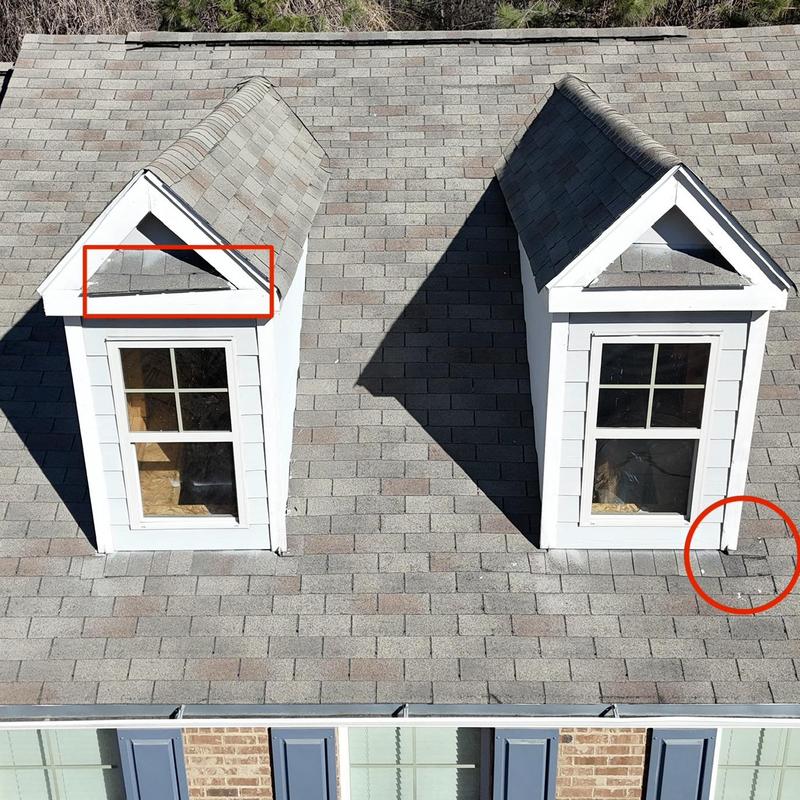 Dormer roof shingles with minor damage circled for replacement