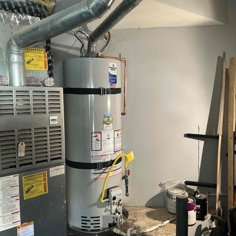Natural gas water heater with supply and gas lines