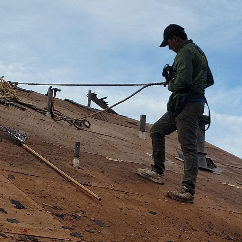 Plywood roof deck inspection with safety harness Plywood roof deck inspection with safety harness