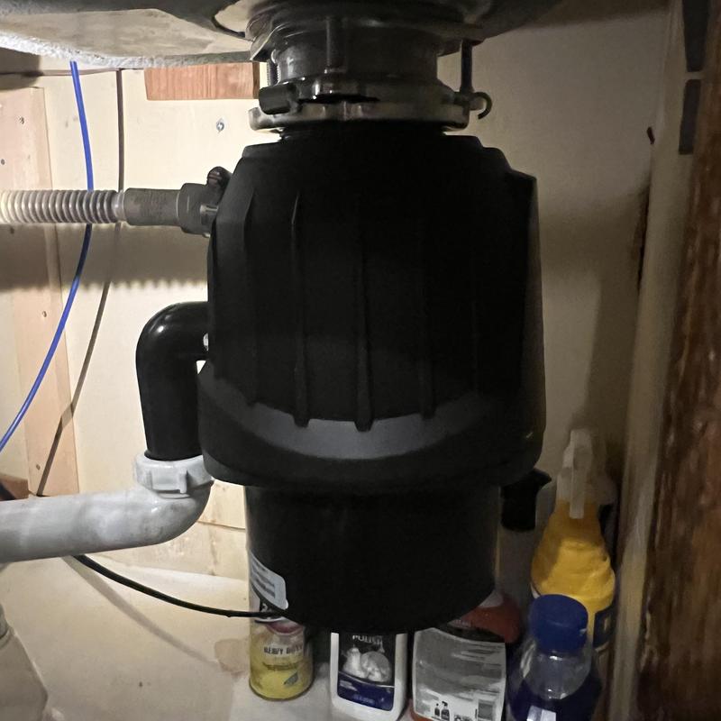 InSinkErator garbage disposal under kitchen sink