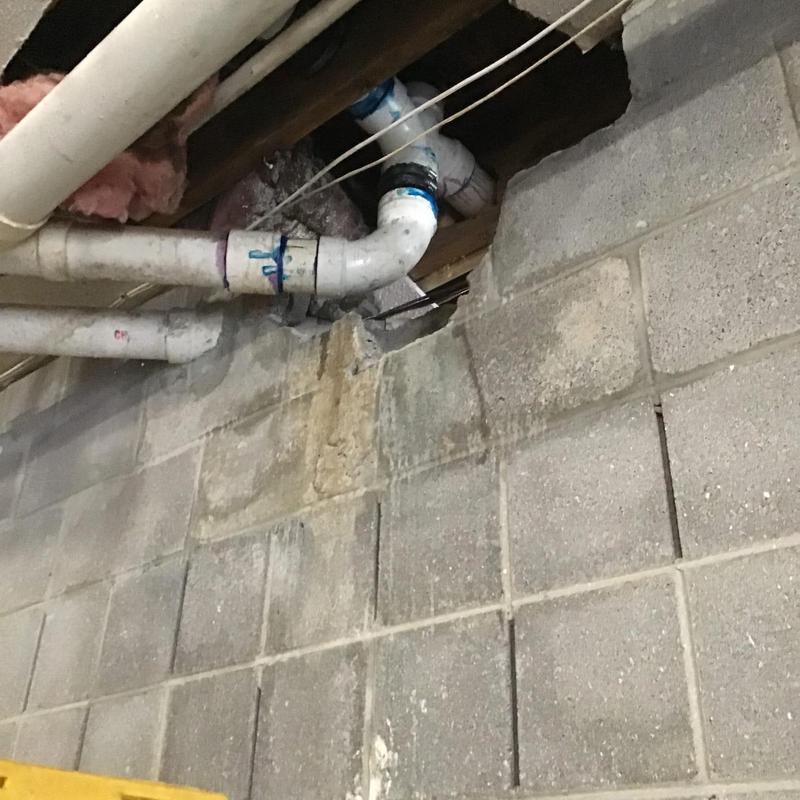 PVC pipe replacement near basement wall and ceiling beams