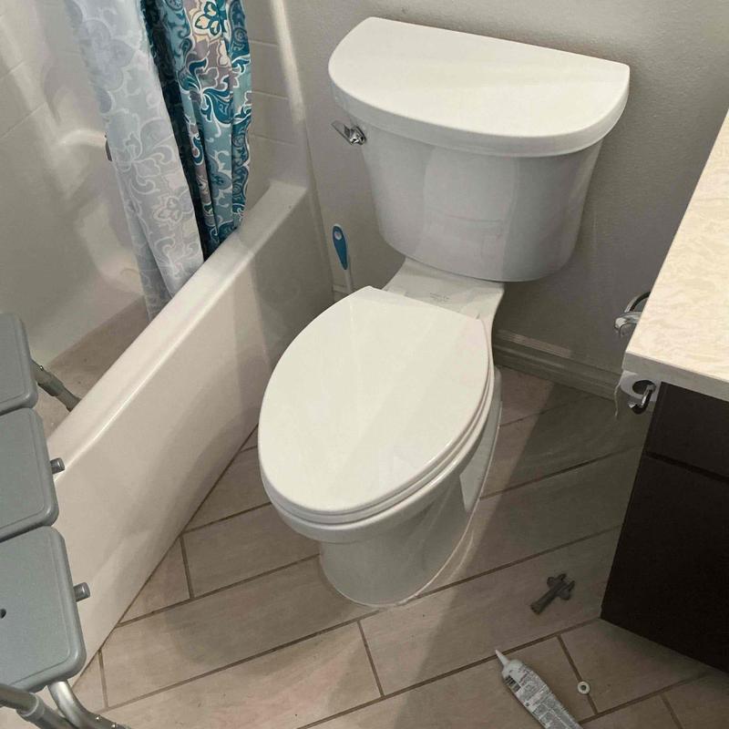 Toilet with replaced wax seal and reset position