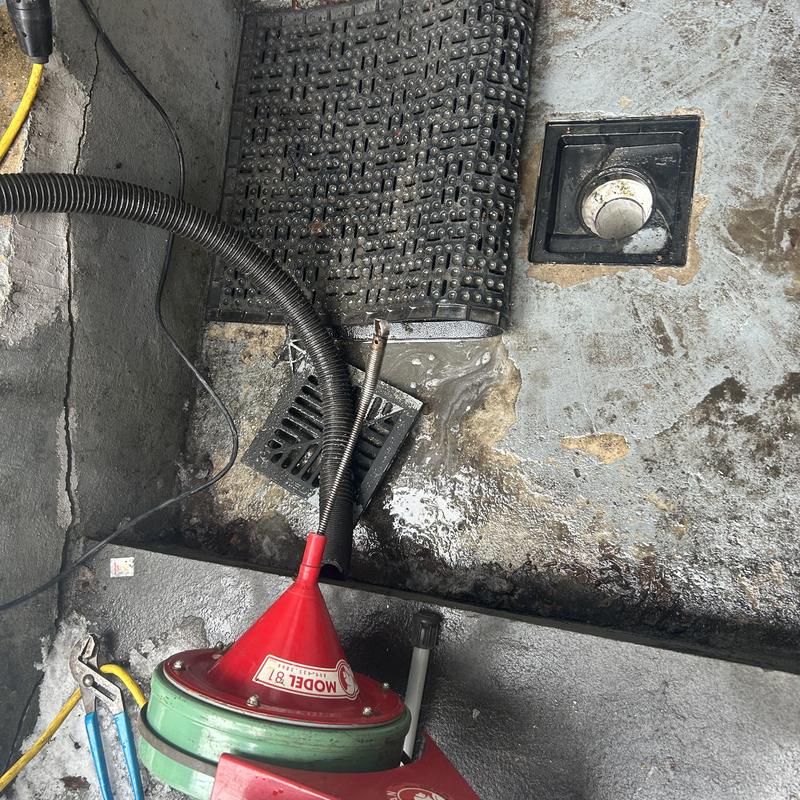 Main line drain with sewer snake and tools Main line drain with sewer snake and tools