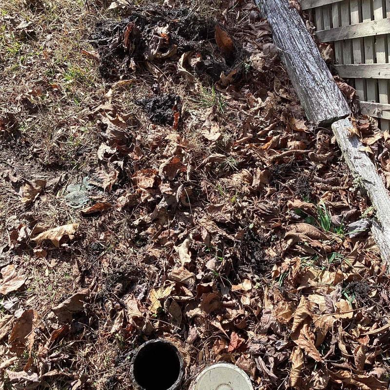 Main cable line access point with exposed conduit outdoors