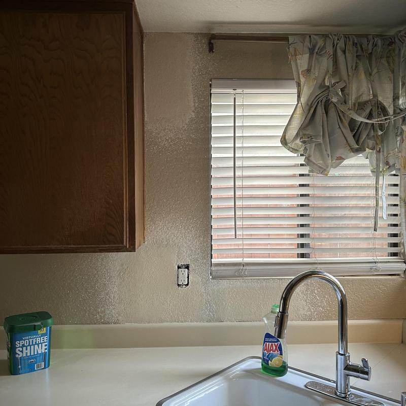 Kitchen faucet and sink with window blinds and cabinet