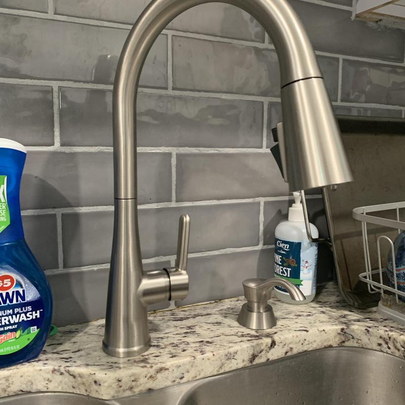 Single handle Delta kitchen faucet with soap dispenser