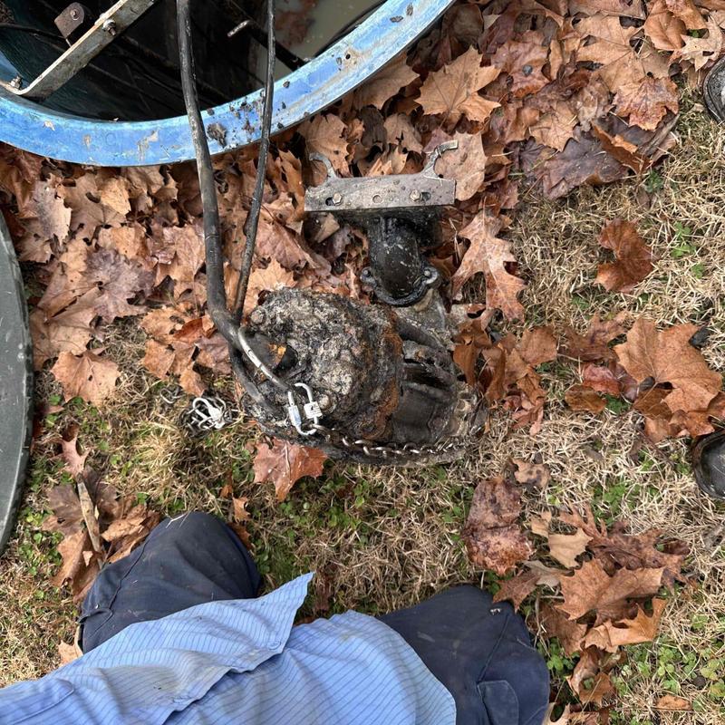 Sump pump removed for ohm testing and breaker reset