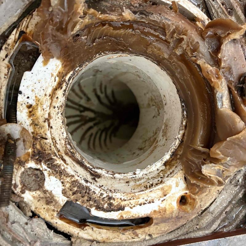 Toilet PVC cross tee clogged line interior view