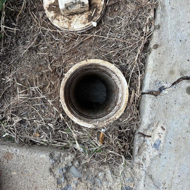 Mainline sewer cleanout pipe opening outdoors