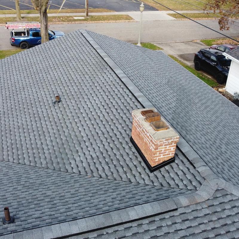 Timberline UHDZ shingle roof with brick chimney Timberline UHDZ shingle roof with brick chimney