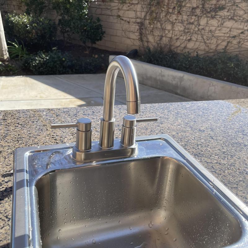 Brushed nickel 4-center faucet on outdoor sink