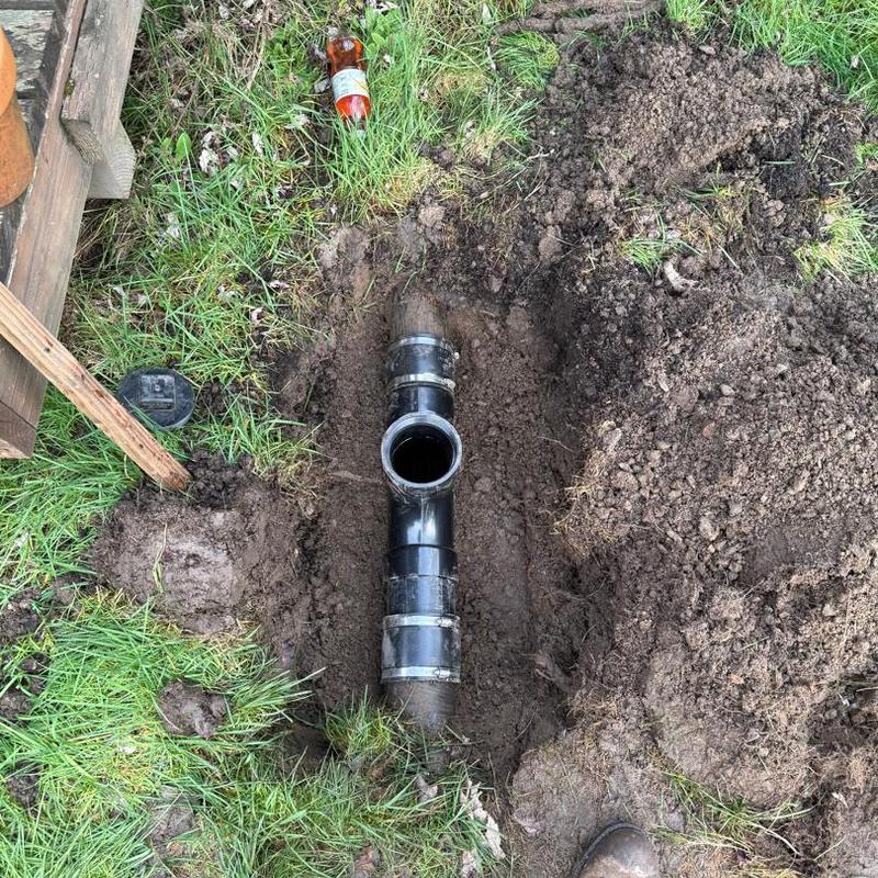 Sewer main with two-way cleanout pipe installation