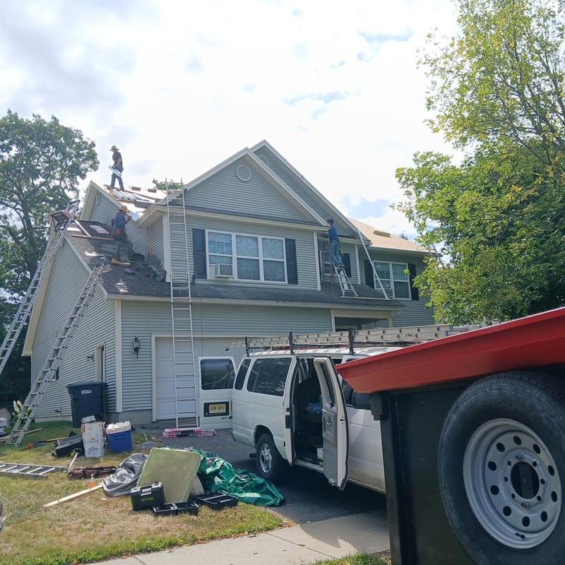 Asphalt shingle roofing installation on residential house