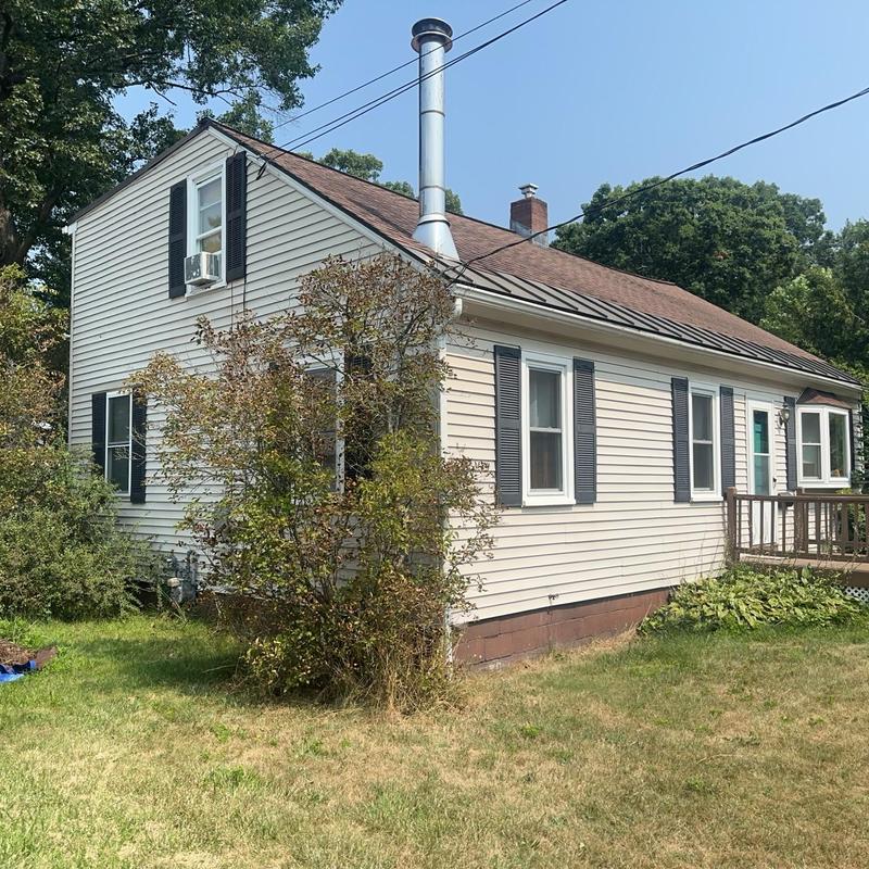 Asphalt shingle roof with metal snow belt in Vermont