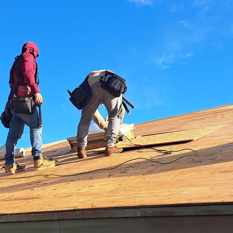 Plywood roof decking installation with skylight opening