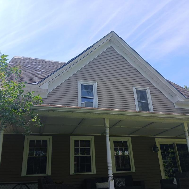 Asphalt shingle roof with metal snow belt in Vermont