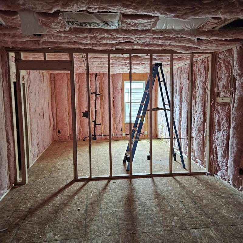 Attic insulation and framing with ladder setup Attic insulation and framing with ladder setup