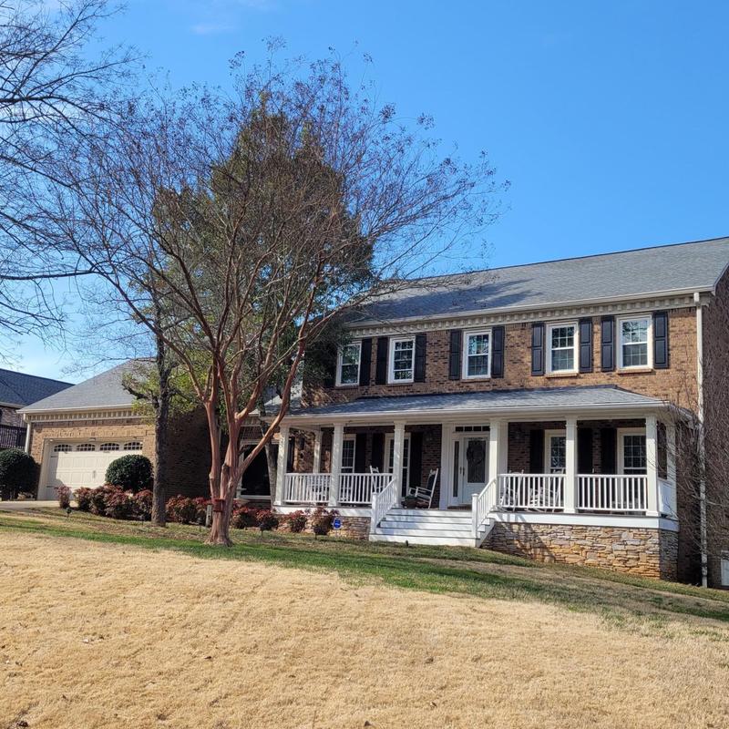 Asphalt shingle roof on two-story brick house