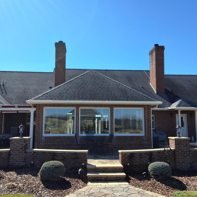 Shingle roof with chimney and patio bricks