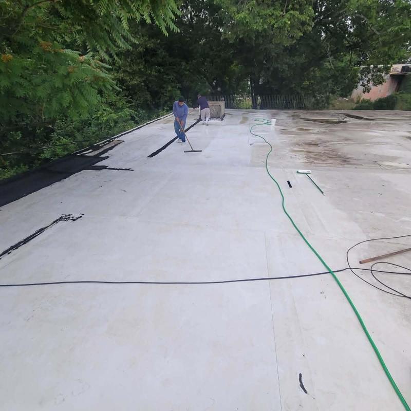 TPO flat roof with silicone coating application