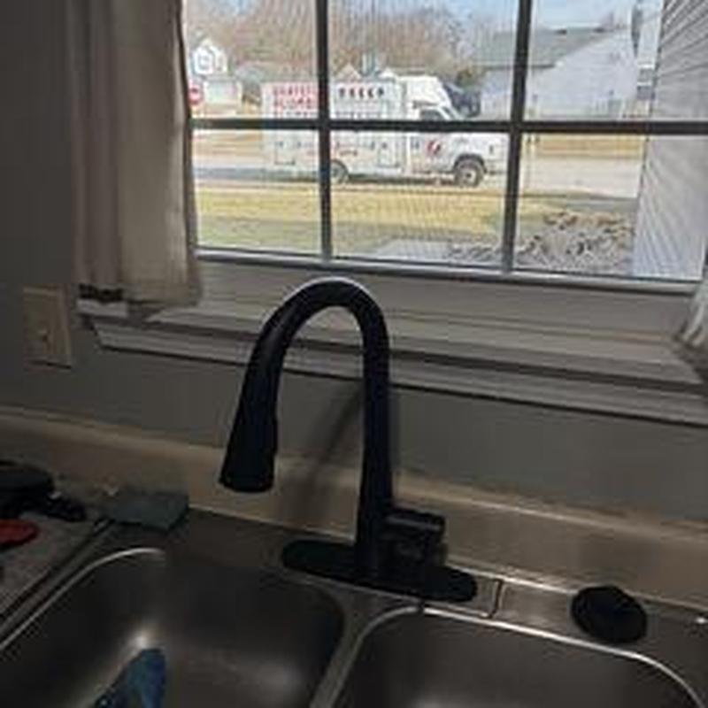 Kitchen faucet installation with black gooseneck spout