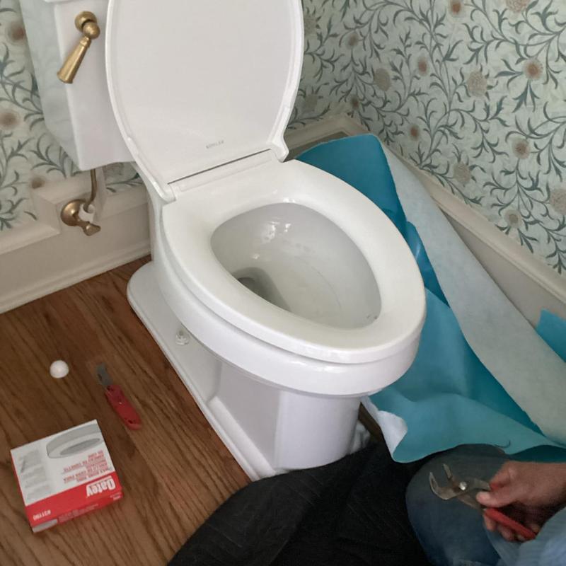 Toilet bowl with tools for line clearing and inspection