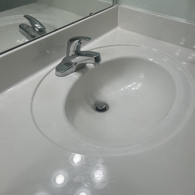 Lavatory faucet and sink with white countertop