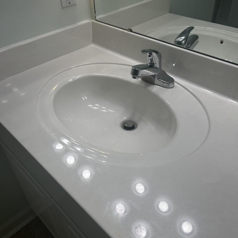 Lavatory faucet and sink with countertop and mirror